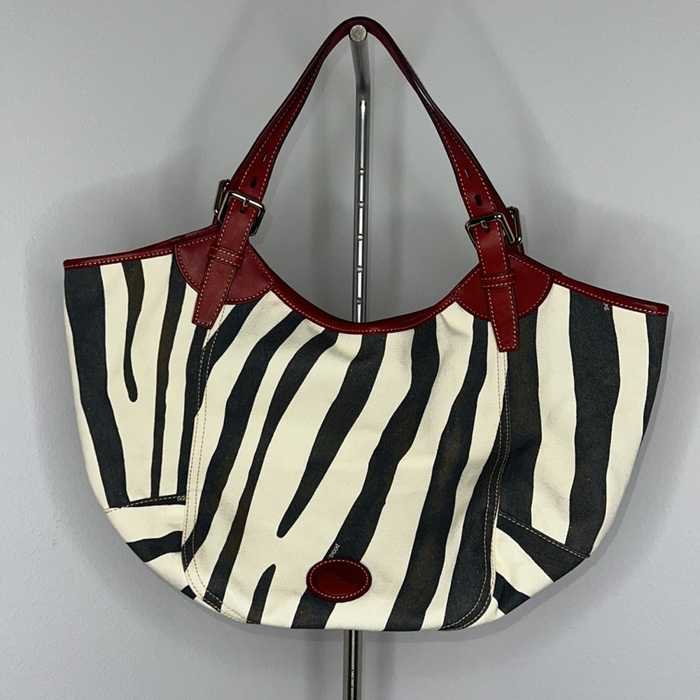 Dooney & Bourke Zebra Print Tote with Red Accents
In pristine condition.